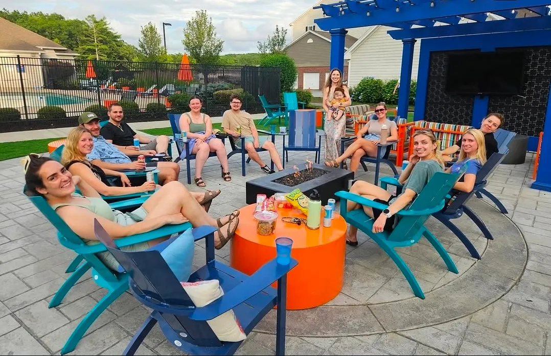 Residents socializing at a housing complex patio